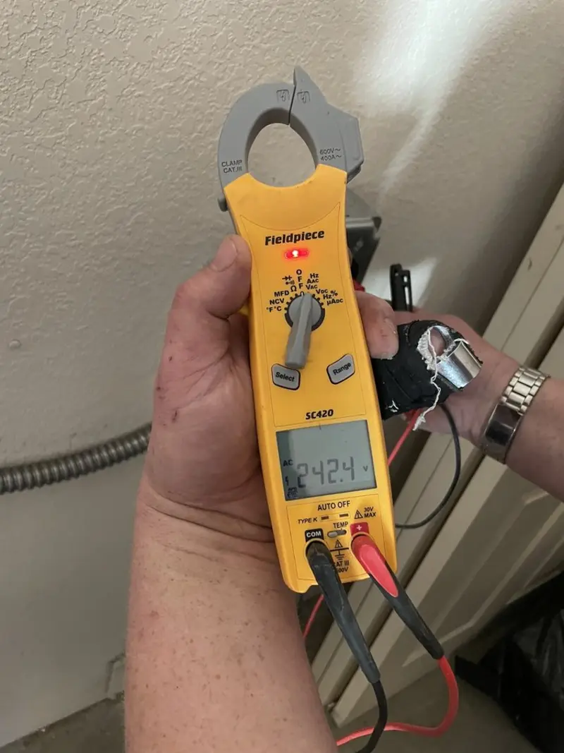 Voltage testing with clamp meter during Whole House Surge Protector in New Bedford